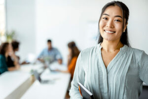 busy businesswoman smiling in doorway