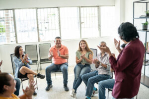 applauding group meeting
