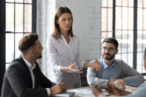businesswoman conducts meeting in the baordroom