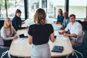 marketing exec addressing meeting