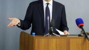 speaking at microphone