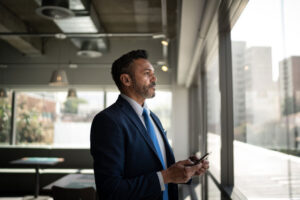 businessman looking out window