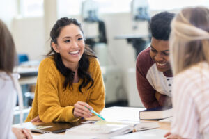 cheerful students studying together