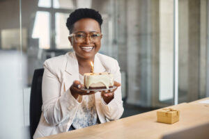 having cake at desk