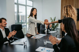shaking hands in the boardroom 
