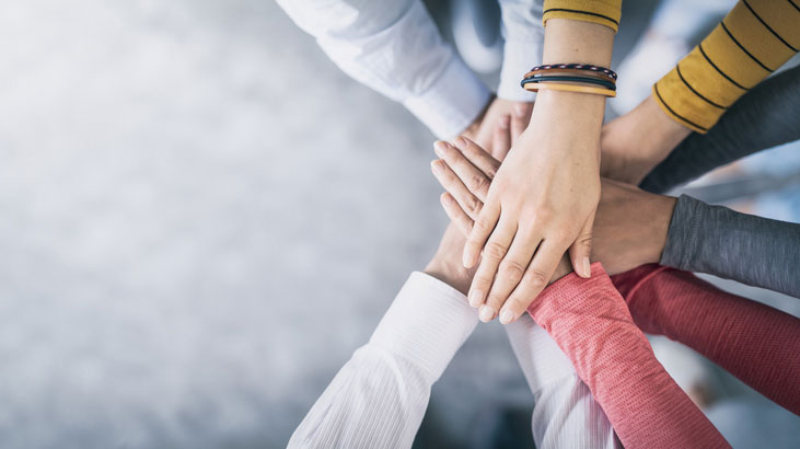 unity through joined hands