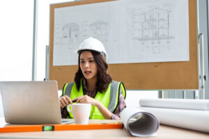 working on a laptop in protective gear